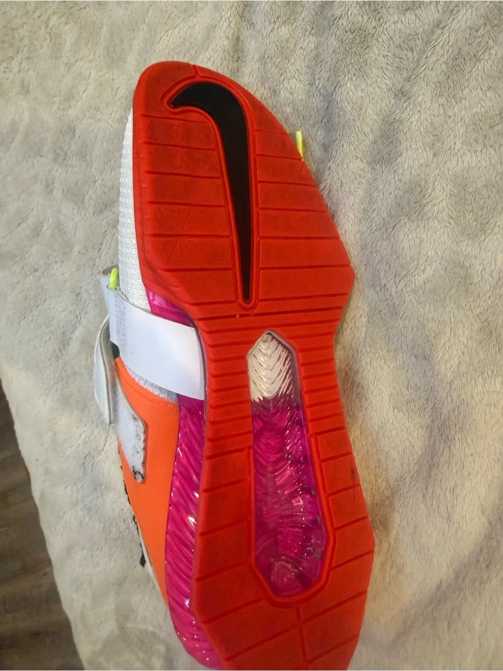 Nike White Athletic Shoes with Black Swoosh and Red Sole